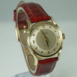  Gruen Precision automatic wristwatch in 14 karat yellow
                                        gold with brown leather band