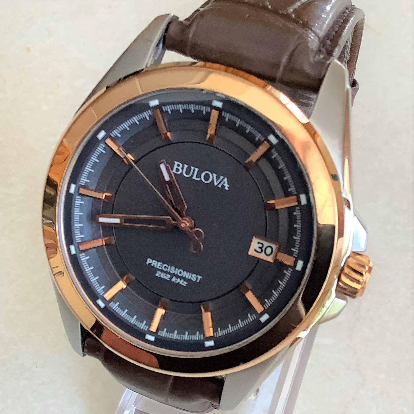 Bulova Precisionist wristwatch in stainless steel with gold-filled bezel on leather band