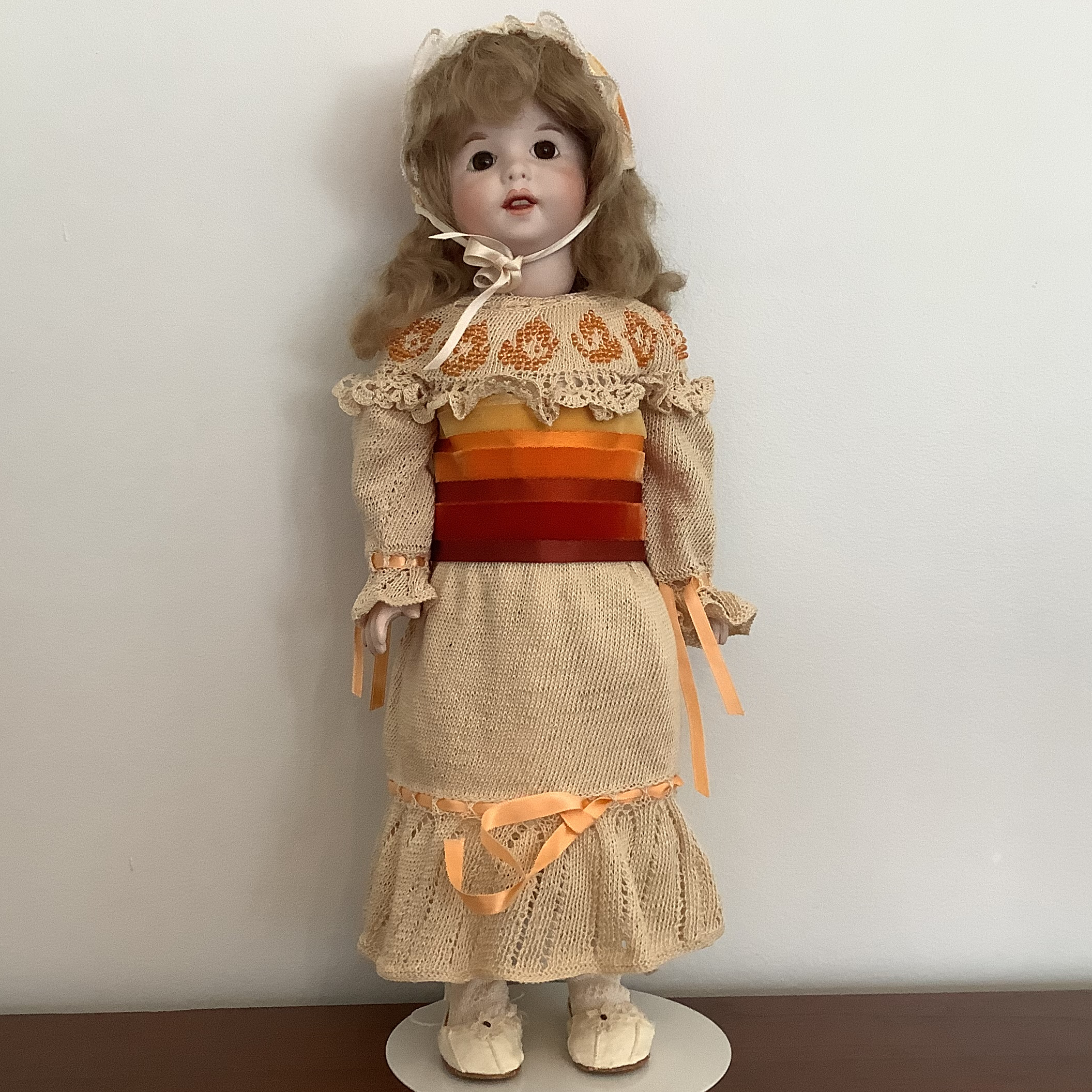 ReproductionSFBJ Twirp doll in crocheted dress and matching velvet ribbon bonnet, front view