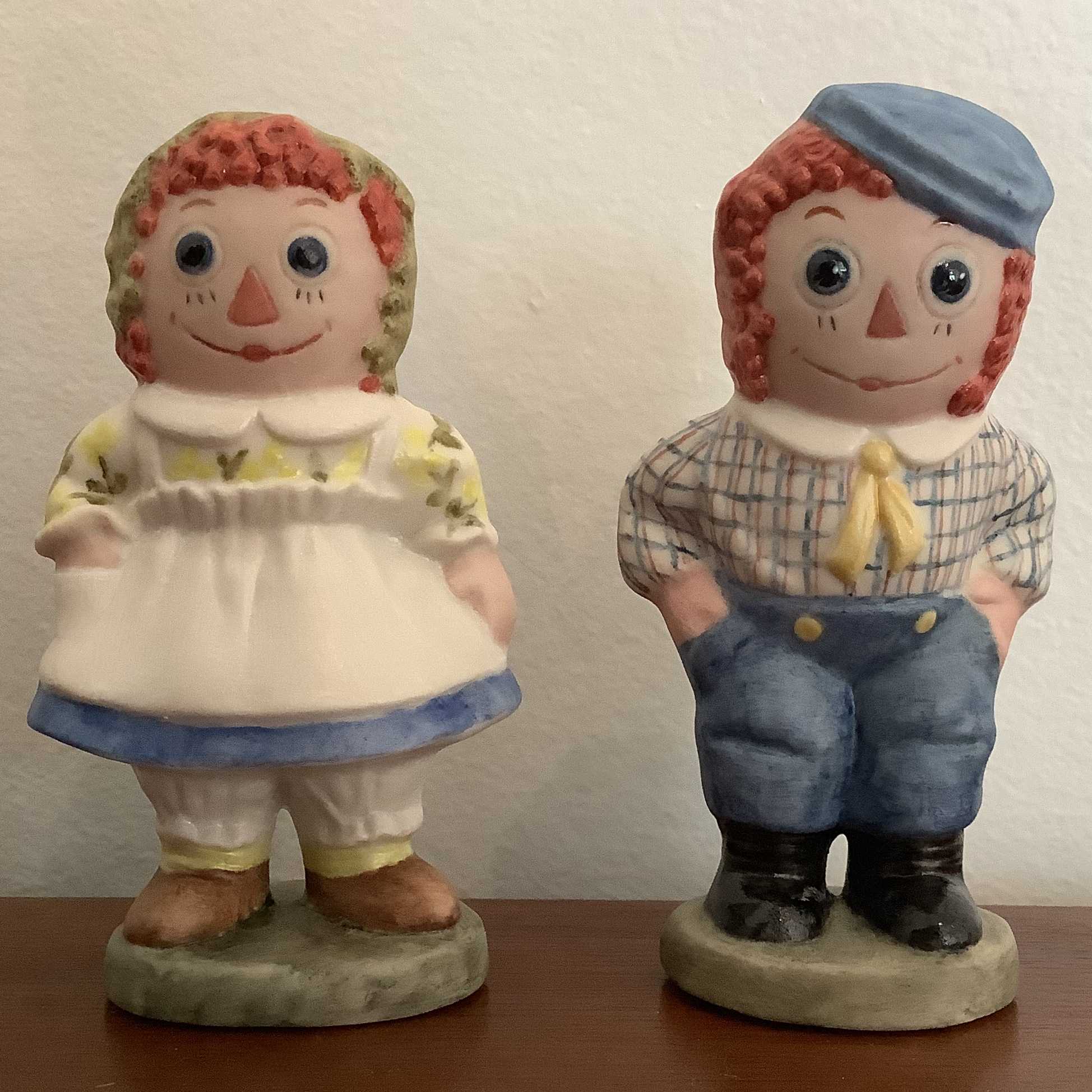 Porcelain Raggedy Ann and Andy figurines, front view
