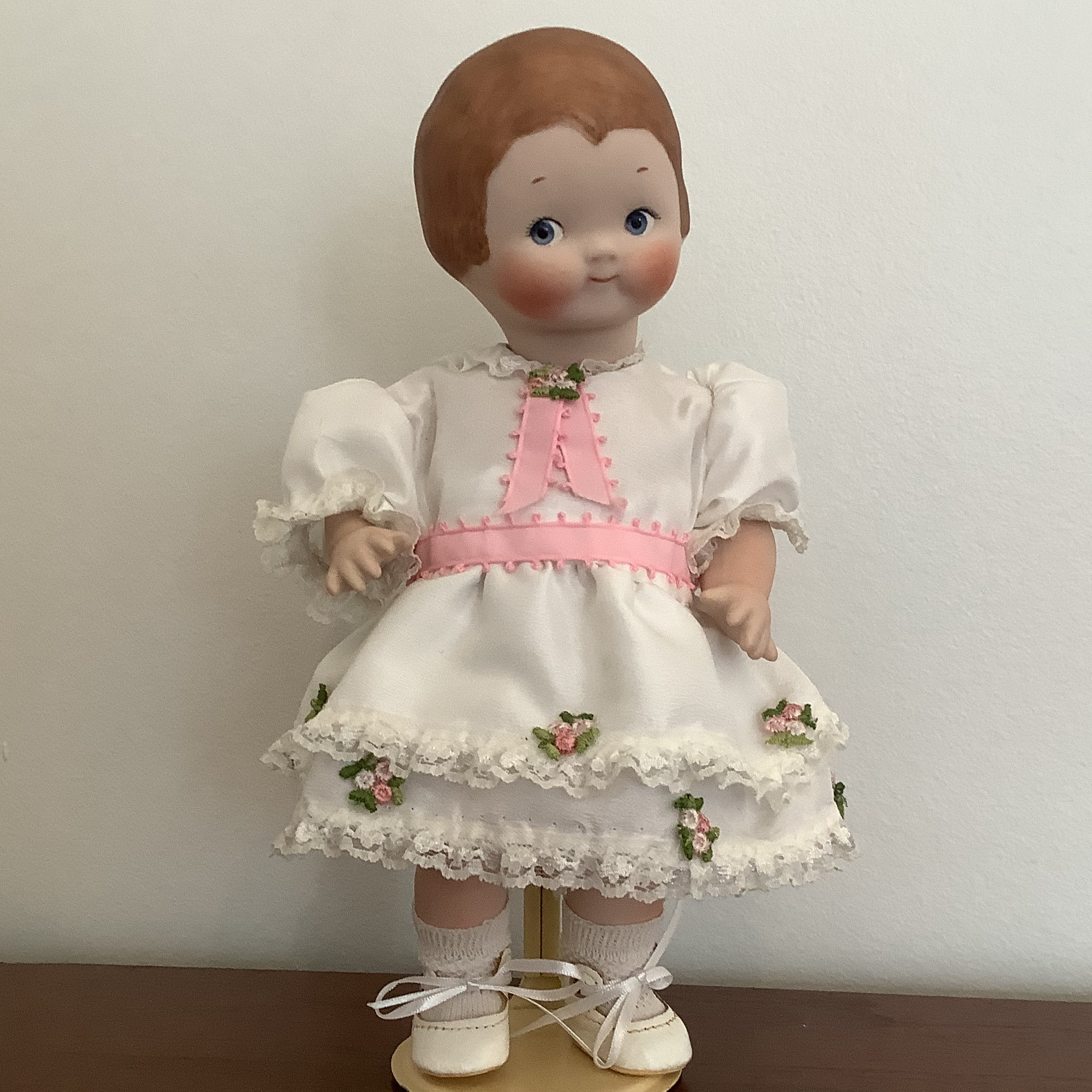 Reproduction doll in the style of Grace Drayton, 10 inches tall and wearing a white dress