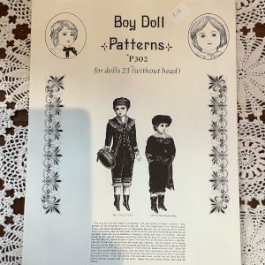 Sewing pattern to make an ornate fur-trimmed coat for a 22 to 23-inch doll