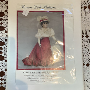 Sewing patterns to make four 1870-style doll dresses for a variety of sizes