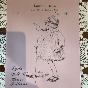 Pattern for short, pleated swing dress with pleated raglan sleeves