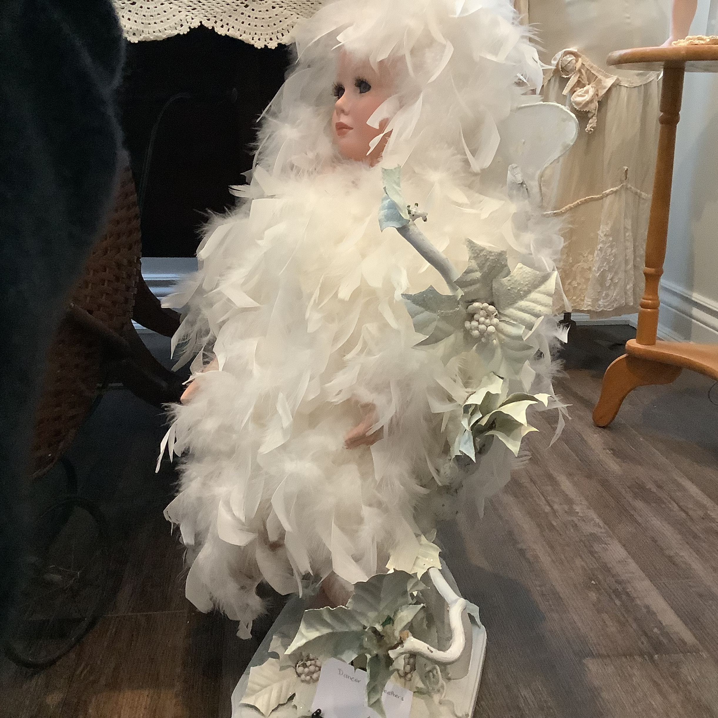 Dancer doll in costume and wig made from white feathers