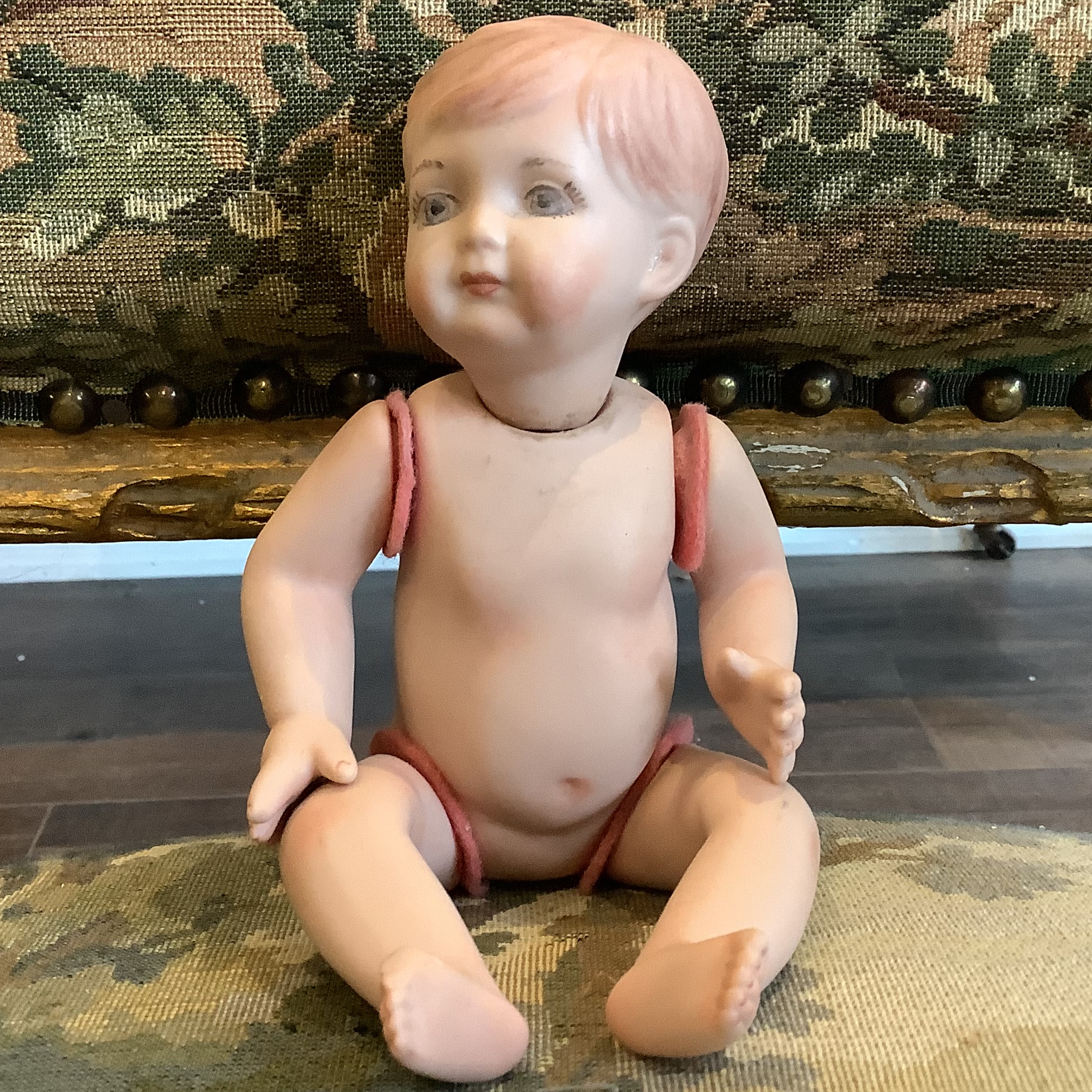 Naked all-porcelain doll, Caucasian, with medium blond hair