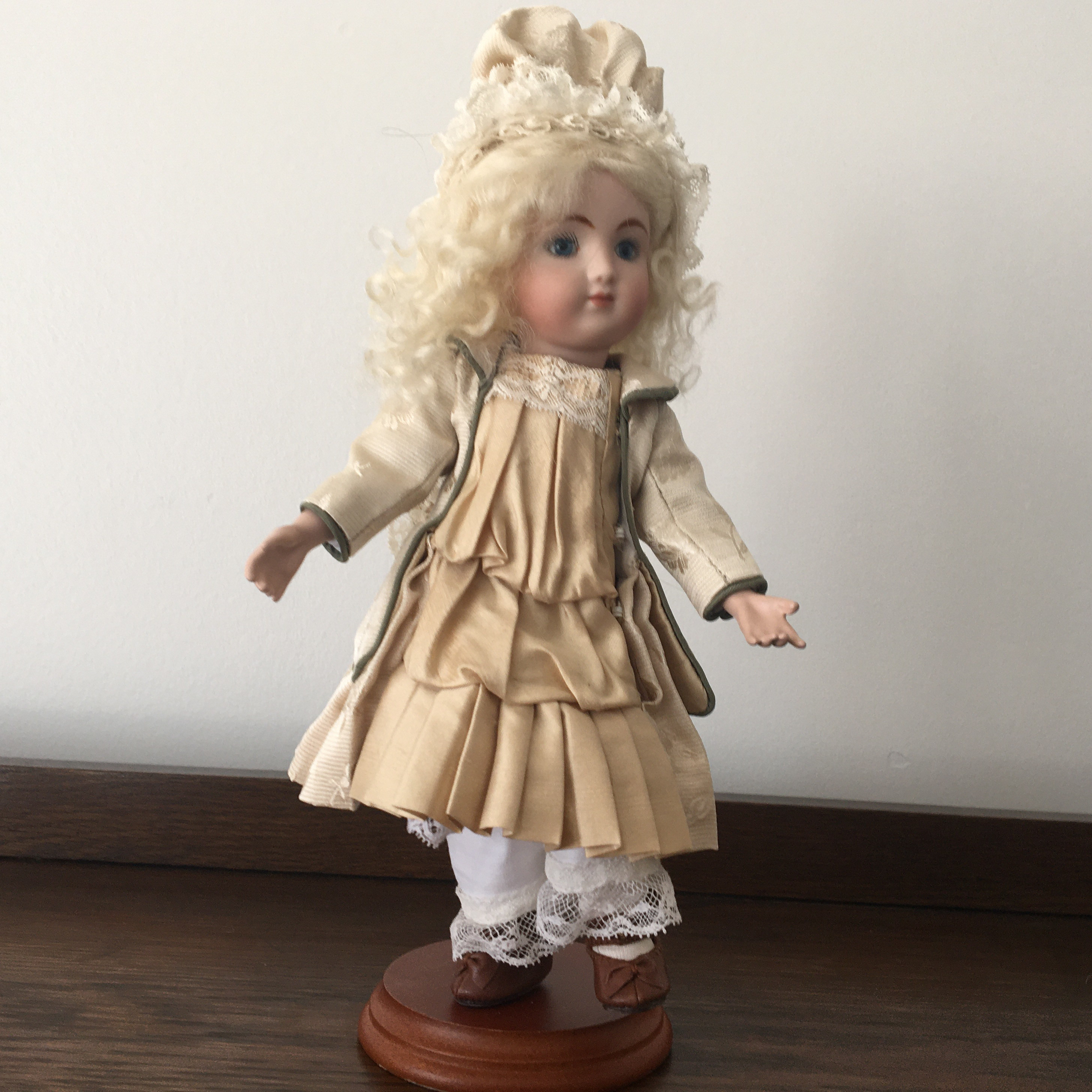 Tiny 11-inch C Steiner reproduction in beige suit, front view