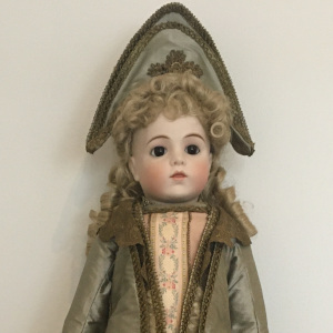 29-inch reproduction Bru doll in elaborate olive green dress and matching hat designed by Kristin Thor, front view