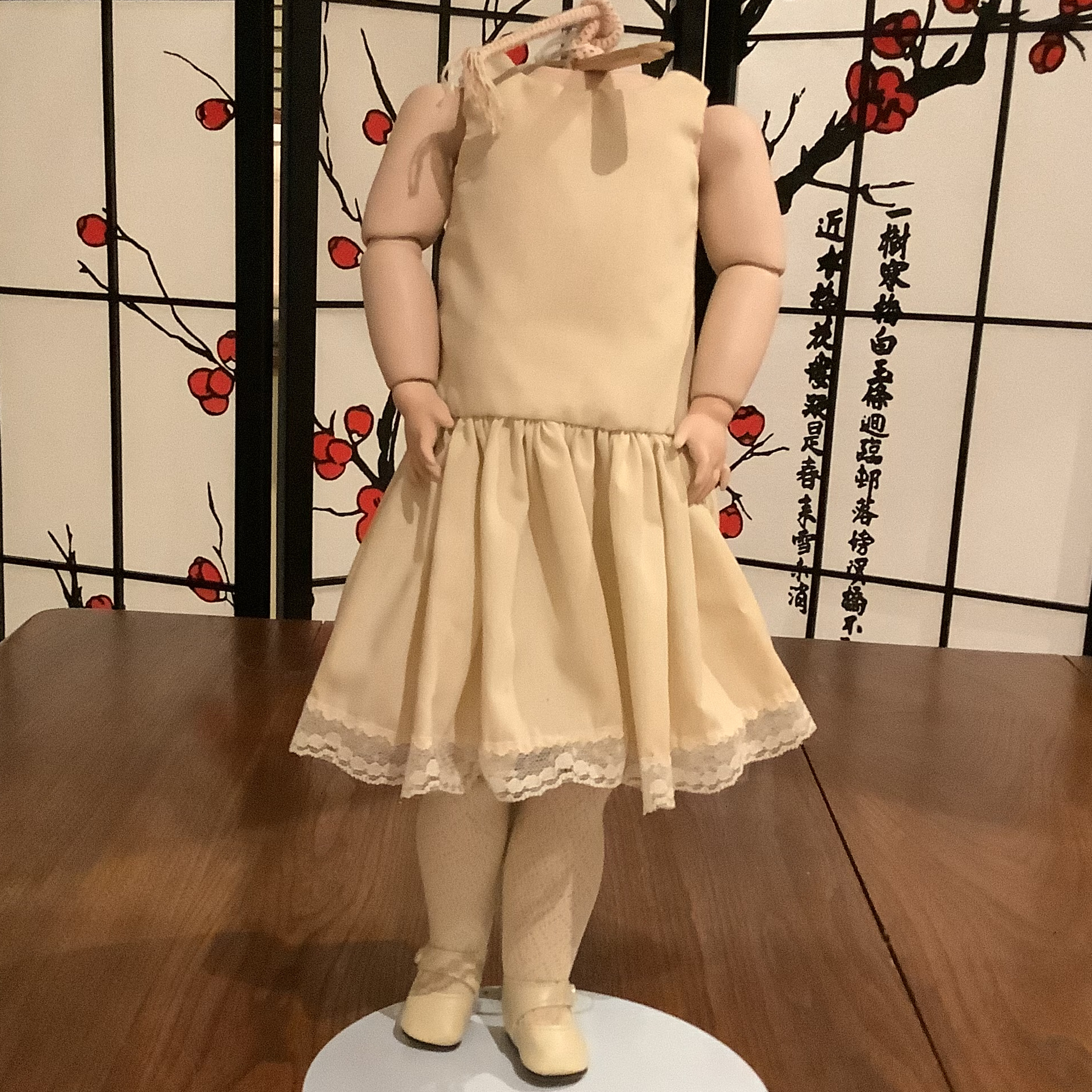 Composition doll body in off-white cotton slip, head not included