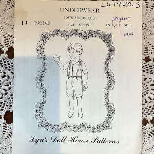Sewing pattern to make a party dress, slip and pantalets for a 14-inch doll