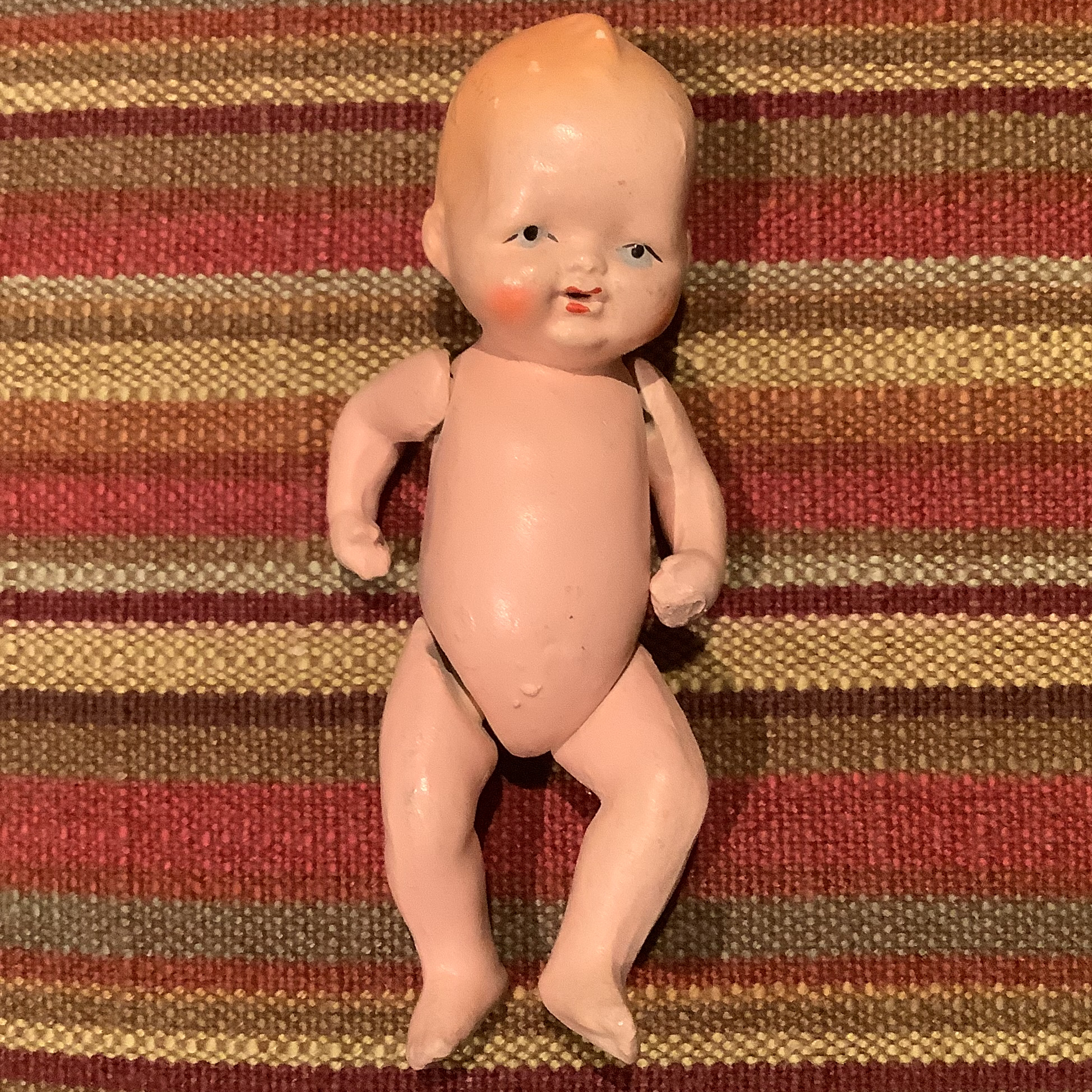 Small vintage baby doll with jointed shoulders and hips