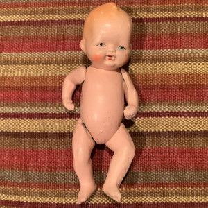 Vintage baby doll with jointed arms and legs