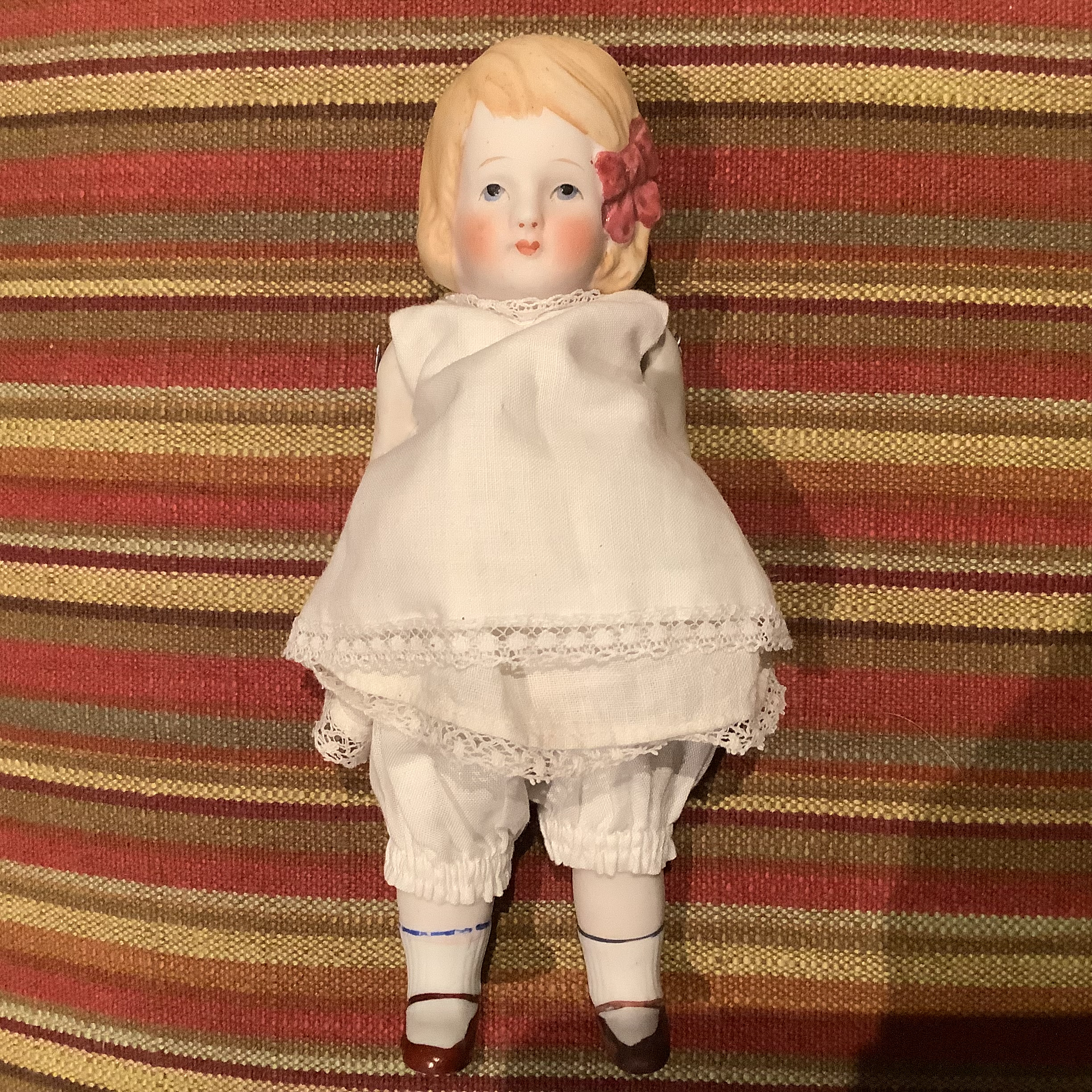 Small vintage girl doll with jointed shoulders and hips