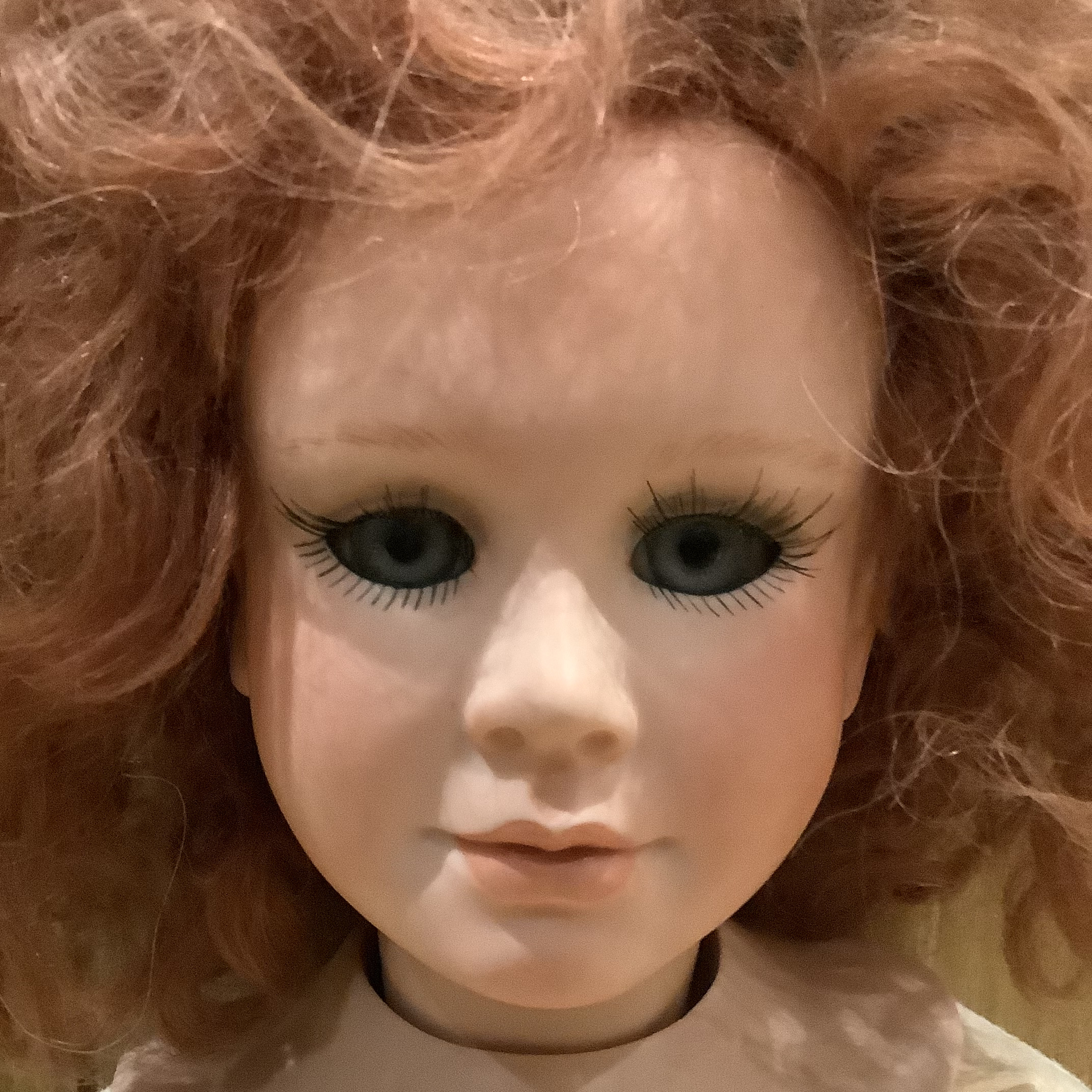 Lady doll face with dark blue eyes