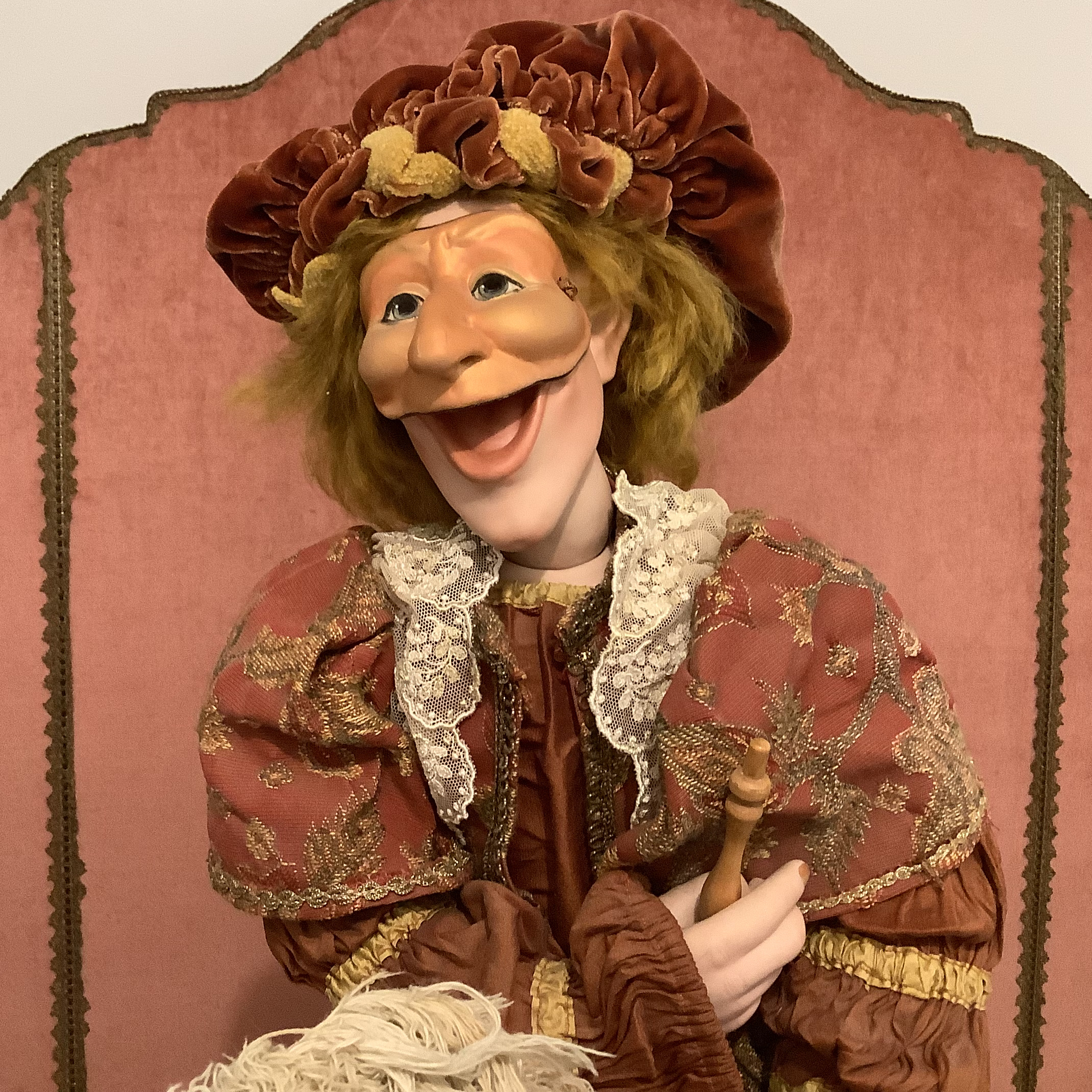 Horseman doll with comically grotesque caricature face in three options, seated on an antique rocking horse